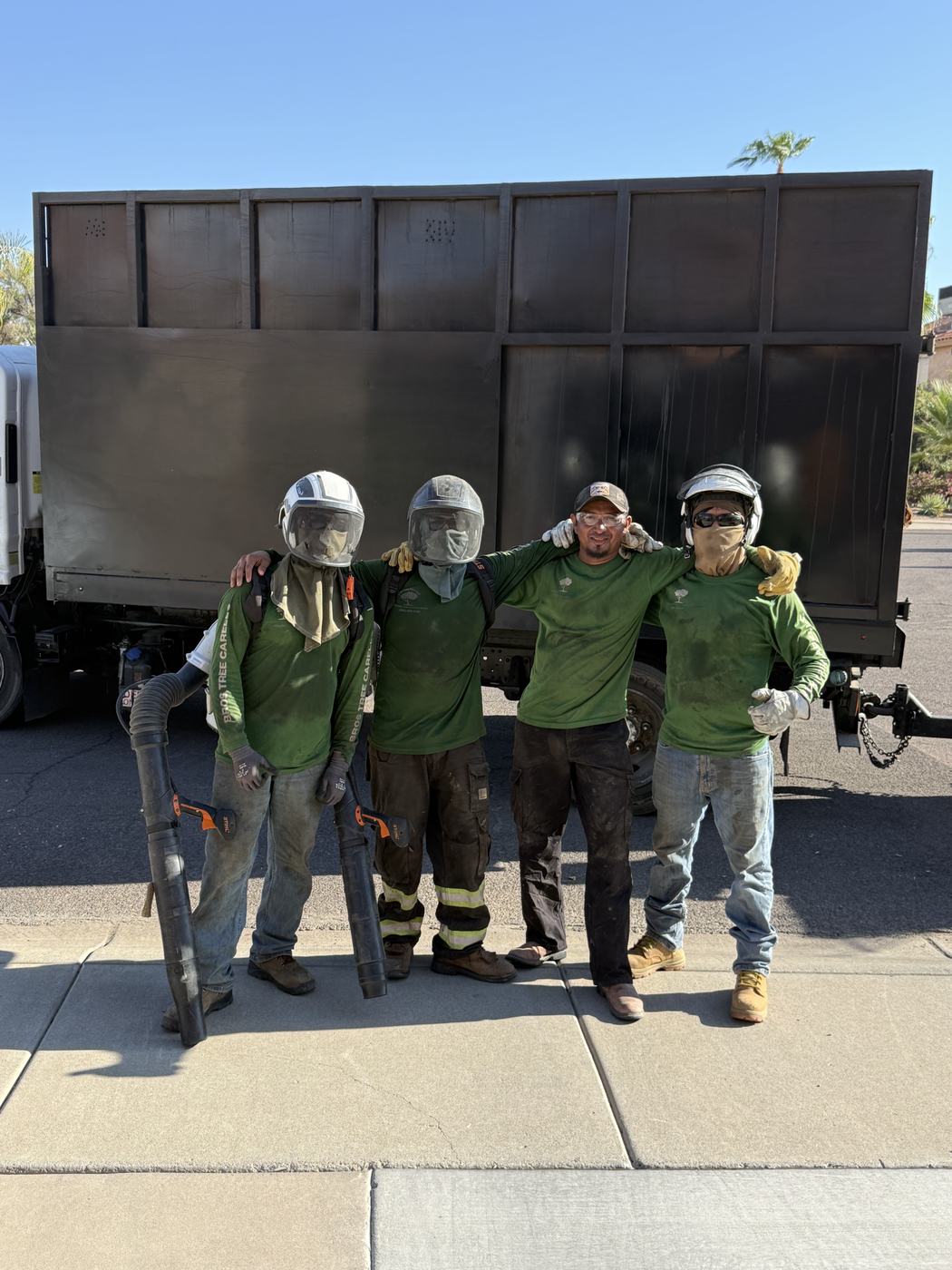 The Bros Tree Care crew in front of their chip truck in Phoenix, AZ
